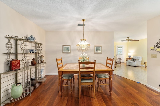9065 SW 82nd Ter Unit G, Ocala, FL 34481 - dining room featuring wood finished floors, ceiling fan, and a textured ceiling