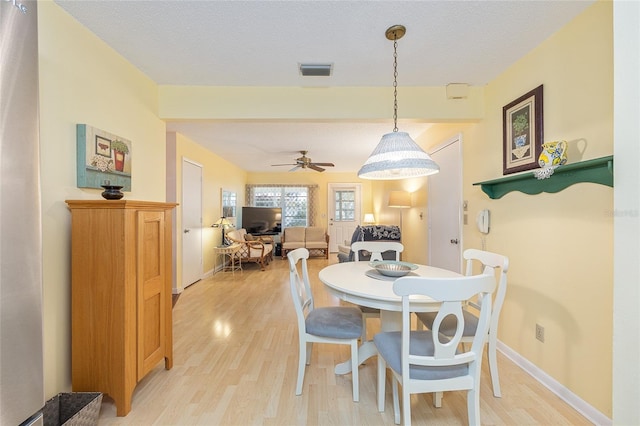 9065 SW 82nd Ter Unit G, Ocala, FL 34481 - dining area with light wood-style flooring and ceiling fan