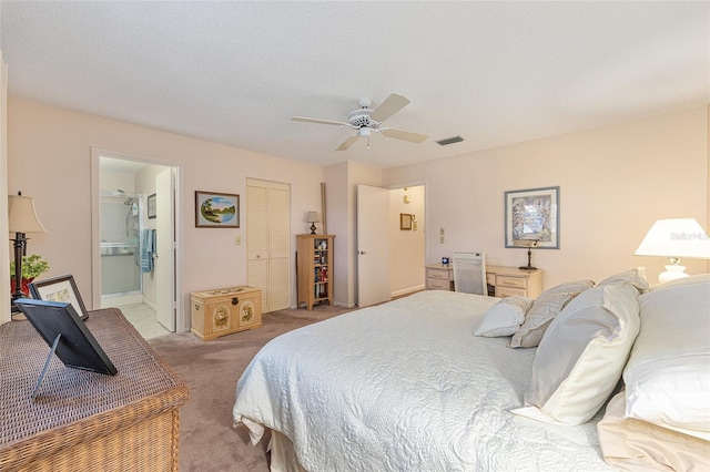 9065 SW 82nd Ter Unit G, Ocala, FL 34481 - bedroom with light carpet, a ceiling fan, ensuite bathroom, and a closet