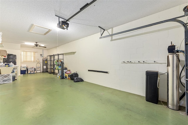 9065 SW 82nd Ter Unit G, Ocala, FL 34481 - garage with a garage door opener and electric water heater