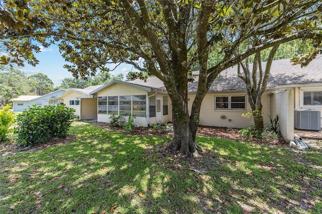9065 SW 82nd Ter Unit G, Ocala, FL 34481 - rear view of property featuring a sunroom and a yard