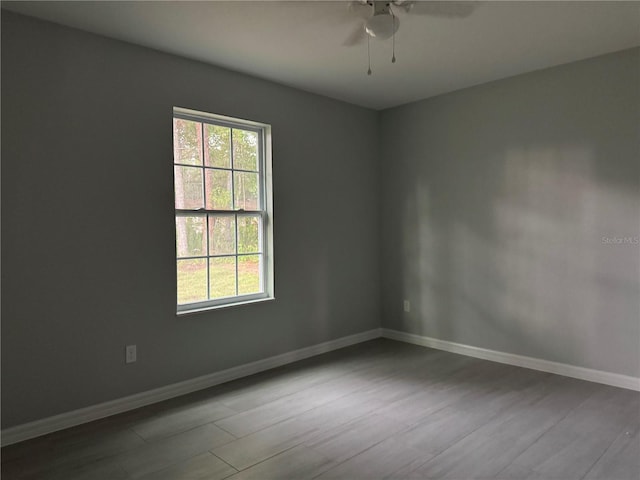 6422 NW 62nd Pl, Ocala, FL 34482 - empty room with wood finished floors and ceiling fan