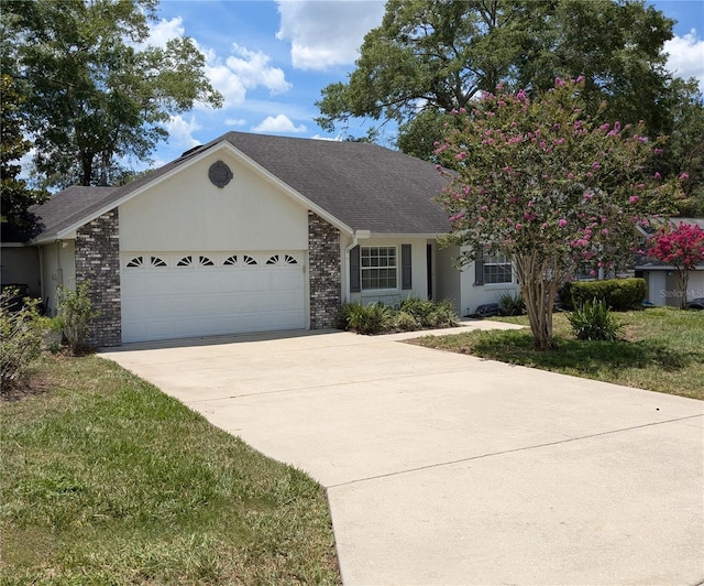 3650 SE 55th Ct, Ocala, FL 34480 - single story home featuring an attached garage, driveway, brick siding, and roof with shingles