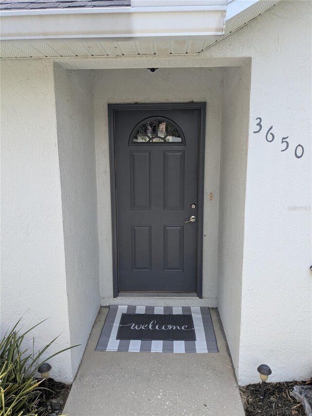 3650 SE 55th Ct, Ocala, FL 34480 - property entrance with stucco siding