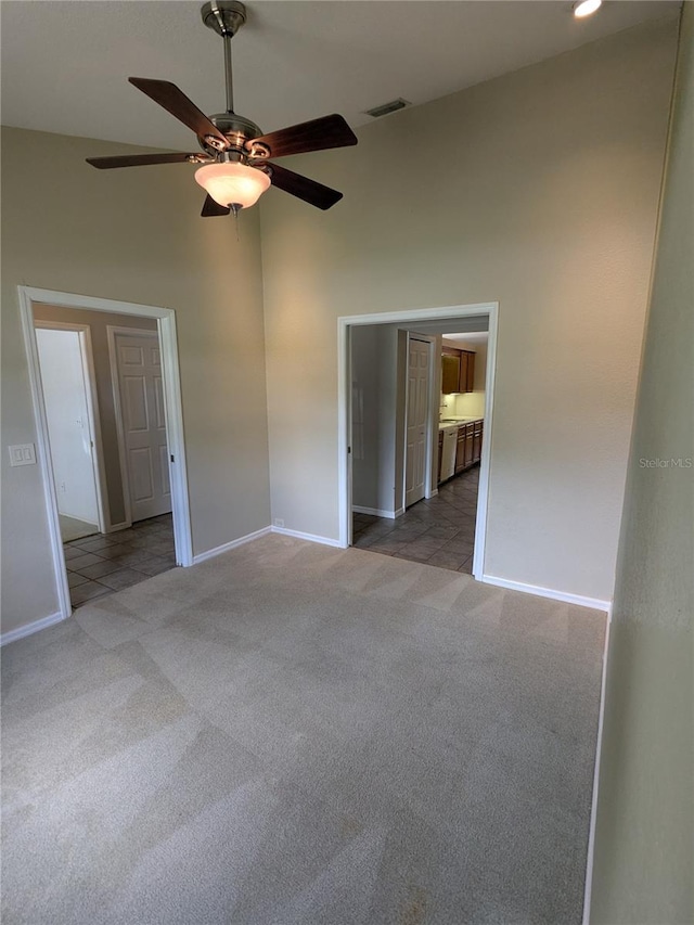 3650 SE 55th Ct, Ocala, FL 34480 - unfurnished bedroom with carpet flooring, a towering ceiling, ensuite bath, and ceiling fan