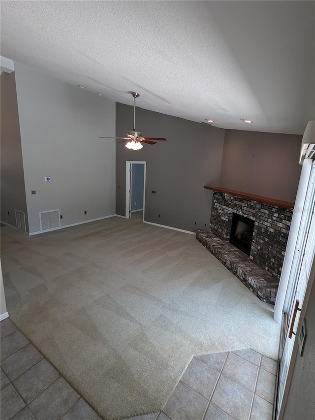 3650 SE 55th Ct, Ocala, FL 34480 - unfurnished living room featuring light carpet, a fireplace, a ceiling fan, and a textured ceiling