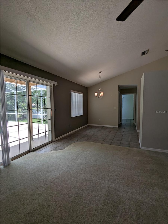 3650 SE 55th Ct, Ocala, FL 34480 - unfurnished room with a chandelier, light carpet, a textured ceiling, vaulted ceiling, and light tile patterned floors
