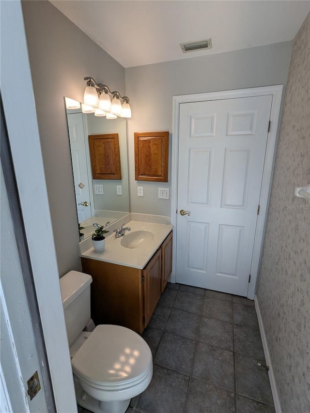 3650 SE 55th Ct, Ocala, FL 34480 - bathroom with vanity, wallpapered walls, and tile patterned floors