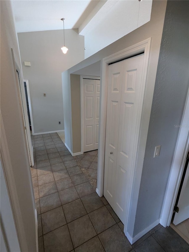 3650 SE 55th Ct, Ocala, FL 34480 - hallway with tile patterned flooring and lofted ceiling