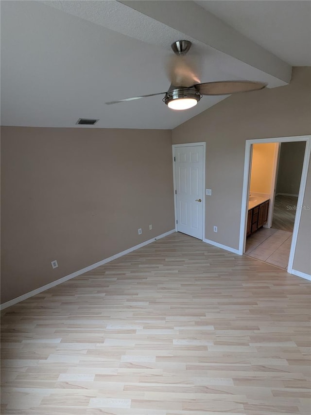 3650 SE 55th Ct, Ocala, FL 34480 - unfurnished bedroom with vaulted ceiling, light wood-type flooring, ensuite bathroom, and ceiling fan