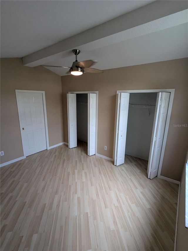 3650 SE 55th Ct, Ocala, FL 34480 - unfurnished bedroom with two closets, light wood-style flooring, and a ceiling fan