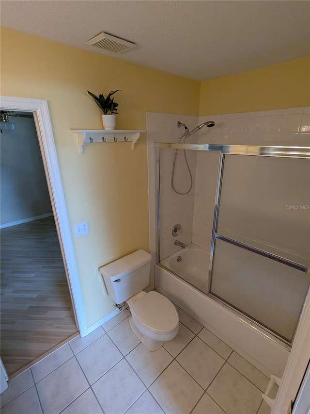 3650 SE 55th Ct, Ocala, FL 34480 - full bath featuring shower / bath combination with glass door and tile patterned flooring