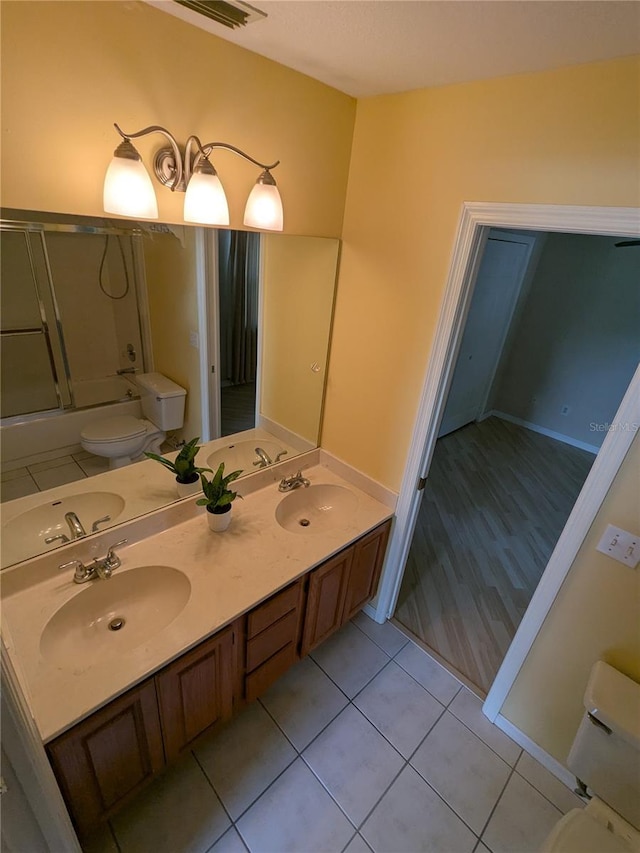 3650 SE 55th Ct, Ocala, FL 34480 - bathroom with shower / bath combination with glass door, double vanity, and tile patterned flooring