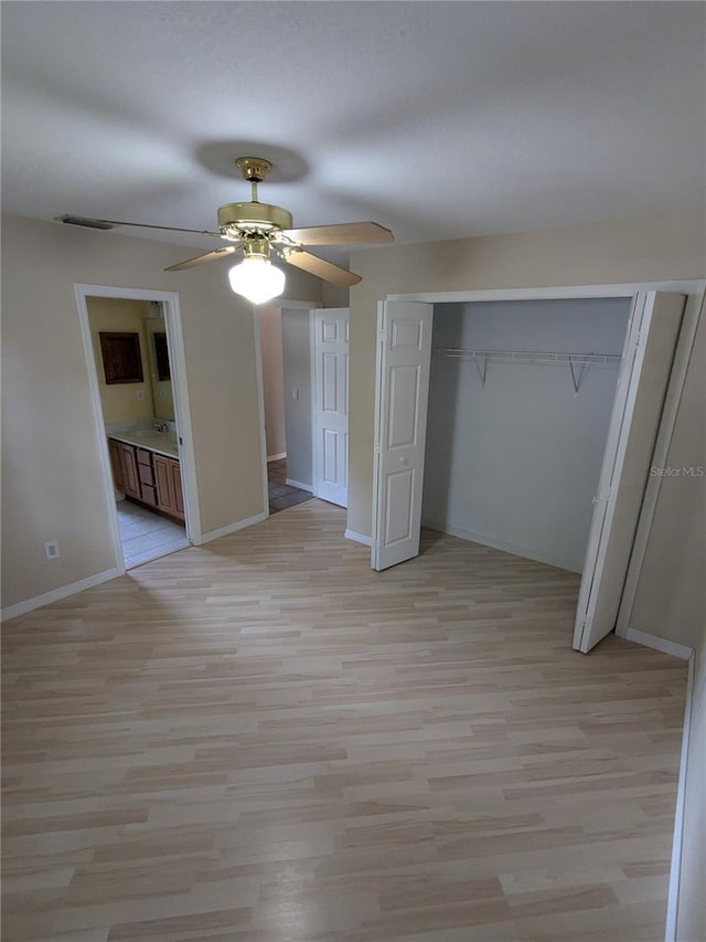 3650 SE 55th Ct, Ocala, FL 34480 - unfurnished bedroom with a closet, light wood-type flooring, and a ceiling fan