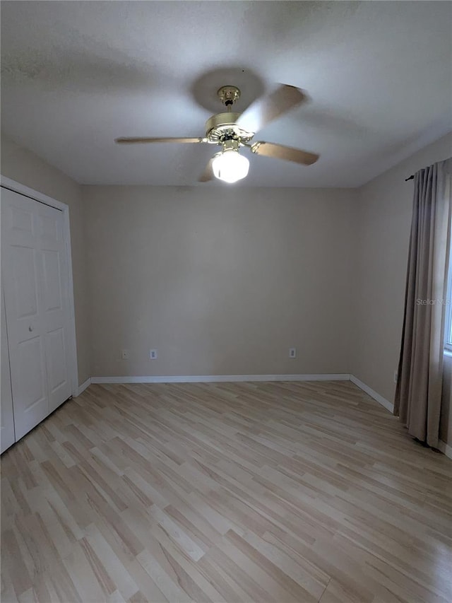 3650 SE 55th Ct, Ocala, FL 34480 - unfurnished bedroom with light wood-style flooring and a ceiling fan
