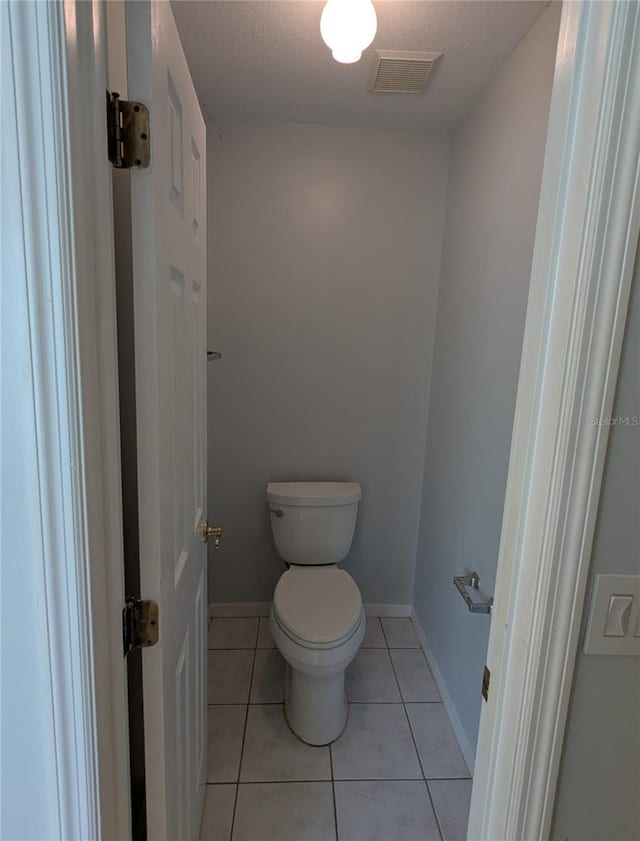 3650 SE 55th Ct, Ocala, FL 34480 - bathroom with tile patterned flooring and a textured ceiling