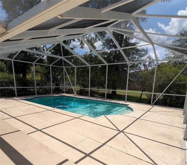 3650 SE 55th Ct, Ocala, FL 34480 - swimming pool with a patio area and glass enclosure