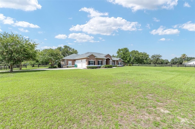 7220 NW 83rd Ter, Ocala, FL 34482 - view of yard featuring an attached garage and driveway