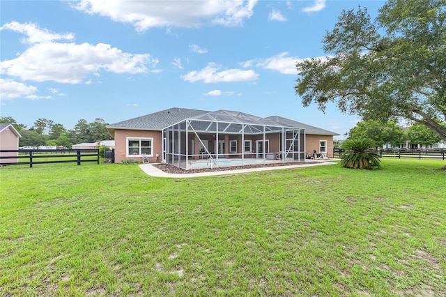 7220 NW 83rd Ter, Ocala, FL 34482 - back of house with a fenced backyard and glass enclosure