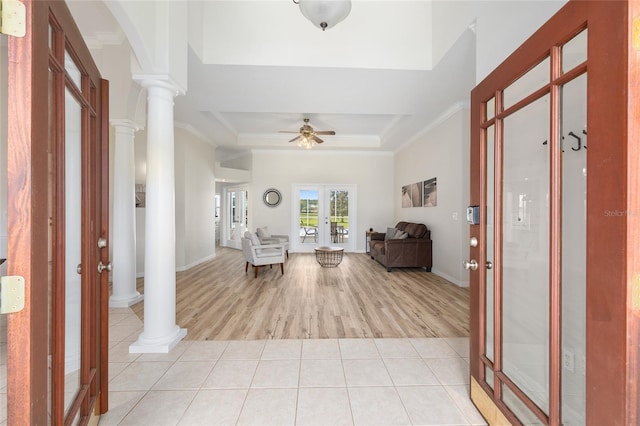 7220 NW 83rd Ter, Ocala, FL 34482 - entrance foyer featuring ornate columns, french doors, ceiling fan, light wood finished floors, and ornamental molding