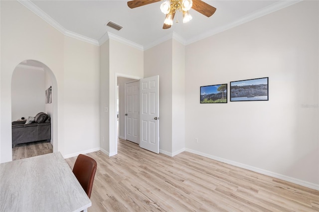 7220 NW 83rd Ter, Ocala, FL 34482 - unfurnished office with a ceiling fan, arched walkways, light wood-style flooring, and ornamental molding