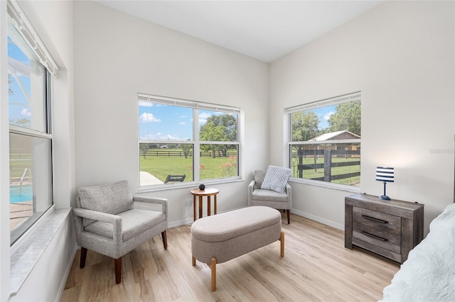 7220 NW 83rd Ter, Ocala, FL 34482 - sitting room with light wood finished floors and baseboards