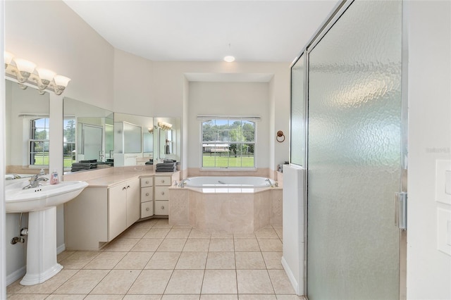 7220 NW 83rd Ter, Ocala, FL 34482 - full bath featuring a bath, tile patterned floors, and a stall shower