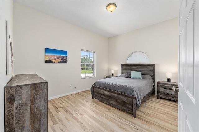 7220 NW 83rd Ter, Ocala, FL 34482 - bedroom featuring light wood-style floors and baseboards