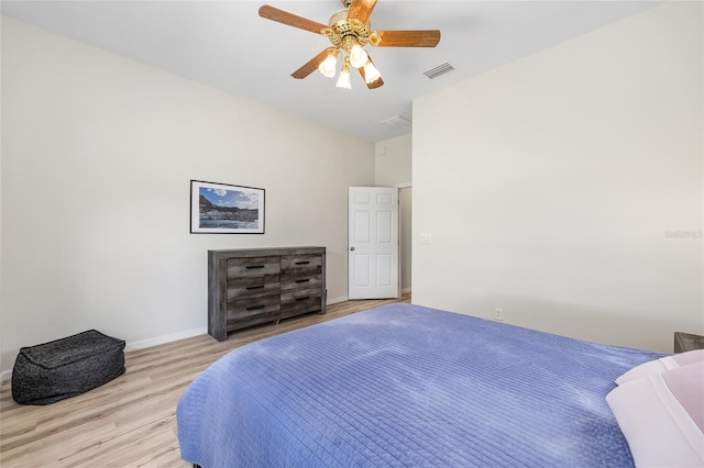 7220 NW 83rd Ter, Ocala, FL 34482 - bedroom with wood finished floors and ceiling fan