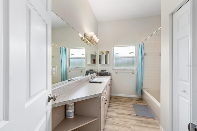 7220 NW 83rd Ter, Ocala, FL 34482 - full bath featuring vanity, wood finished floors, and shower / bath combination with curtain