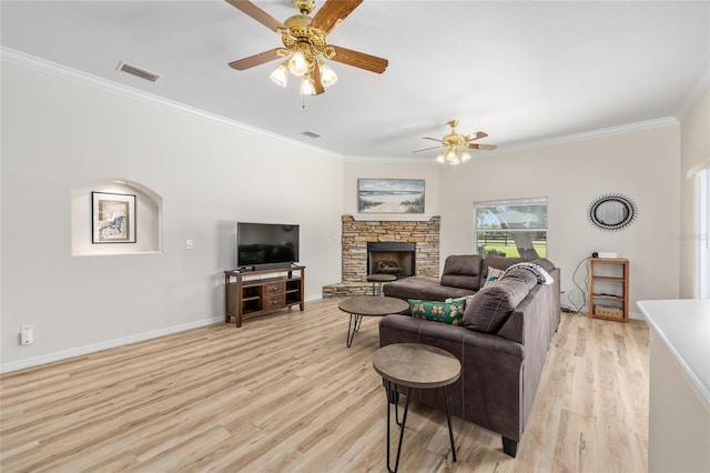 7220 NW 83rd Ter, Ocala, FL 34482 - living area featuring ceiling fan, light wood-style flooring, crown molding, and a fireplace