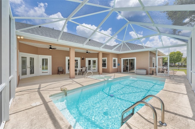 7220 NW 83rd Ter, Ocala, FL 34482 - swimming pool with french doors, ceiling fan, a patio area, and a lanai