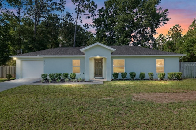 5740 NW 61st St, Ocala, FL 34482 - ranch-style home featuring stucco siding, concrete driveway, an attached garage, and roof with shingles