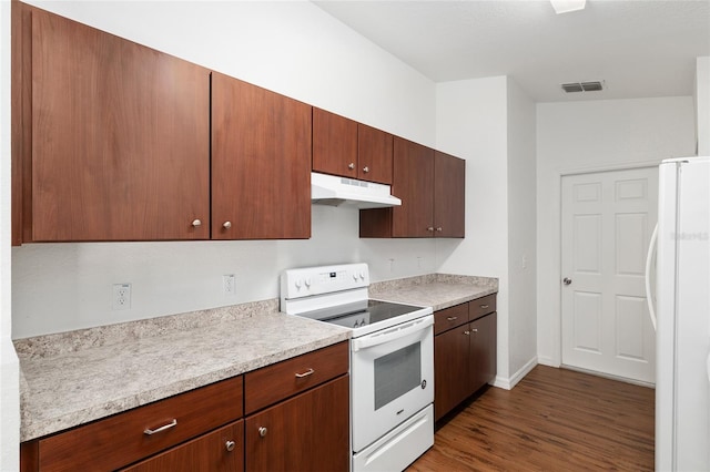 5740 NW 61st St, Ocala, FL 34482 - kitchen with white appliances, under cabinet range hood, light countertops, and dark wood-type flooring