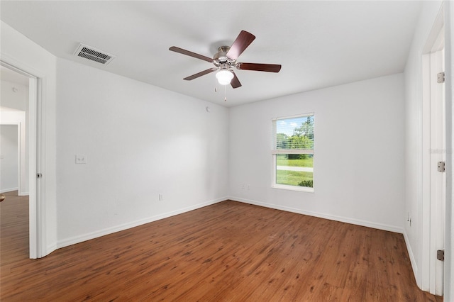 5740 NW 61st St, Ocala, FL 34482 - empty room with wood finished floors and a ceiling fan