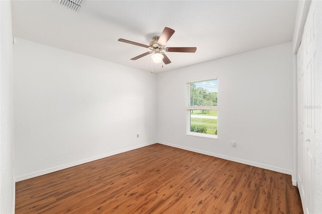5740 NW 61st St, Ocala, FL 34482 - spare room with wood finished floors and a ceiling fan