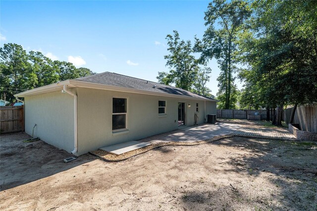 5740 NW 61st St, Ocala, FL 34482 - rear view of property with a fenced backyard, a patio, stucco siding, and roof with shingles