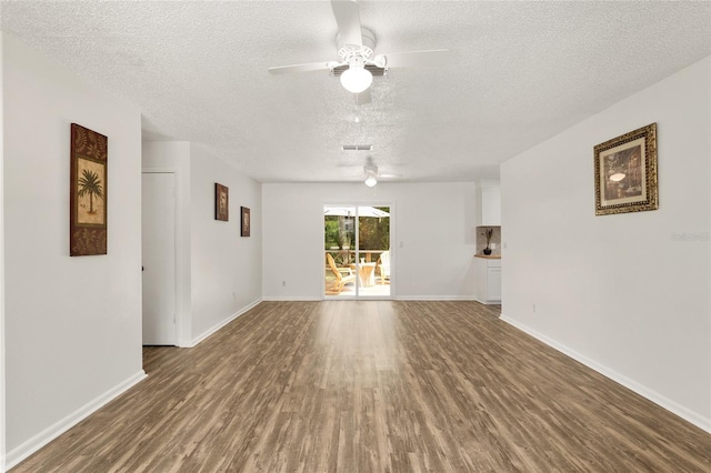 3640 SE 131st Ln, Belleview, FL 34420 - empty room with a textured ceiling, wood finished floors, and a ceiling fan
