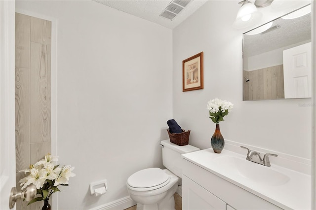 3640 SE 131st Ln, Belleview, FL 34420 - bathroom featuring vanity, a shower, and a textured ceiling