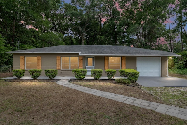 3640 SE 131st Ln, Belleview, FL 34420 - single story home featuring driveway, a garage, covered porch, and view of scattered trees