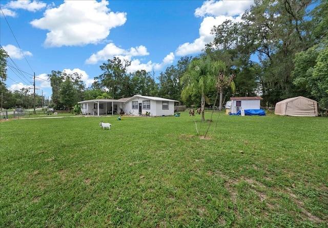 2340 NE 14th Ave, Ocala, FL 34470 - view of yard featuring view of wooded area and a storage shed