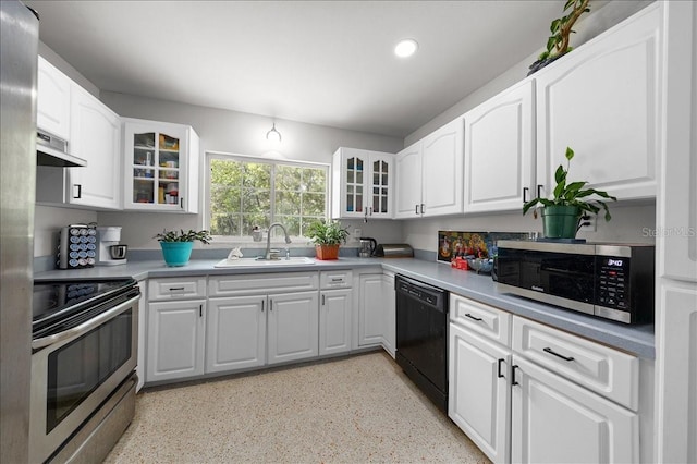 2340 NE 14th Ave, Ocala, FL 34470 - kitchen featuring stainless steel appliances, recessed lighting, glass insert cabinets, exhaust hood, and white cabinetry