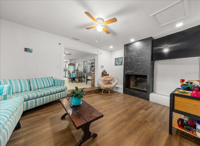 2340 NE 14th Ave, Ocala, FL 34470 - living area with ceiling fan, attic access, wood finished floors, a fireplace, and recessed lighting