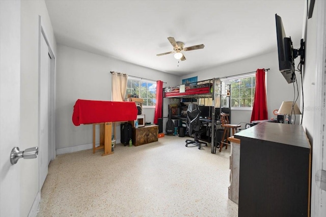 2340 NE 14th Ave, Ocala, FL 34470 - bedroom with multiple windows, speckled floor, an office area, and ceiling fan