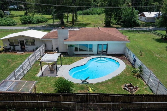 2340 NE 14th Ave, Ocala, FL 34470 - back of house featuring a fenced backyard, a patio, and a chimney