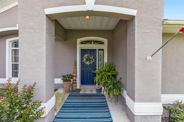6362 N Walter Ter, Citrus Springs, FL 34434 - doorway to property featuring stucco siding