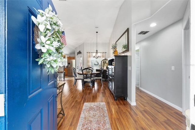 6362 N Walter Ter, Citrus Springs, FL 34434 - foyer featuring a chandelier and dark wood-style flooring
