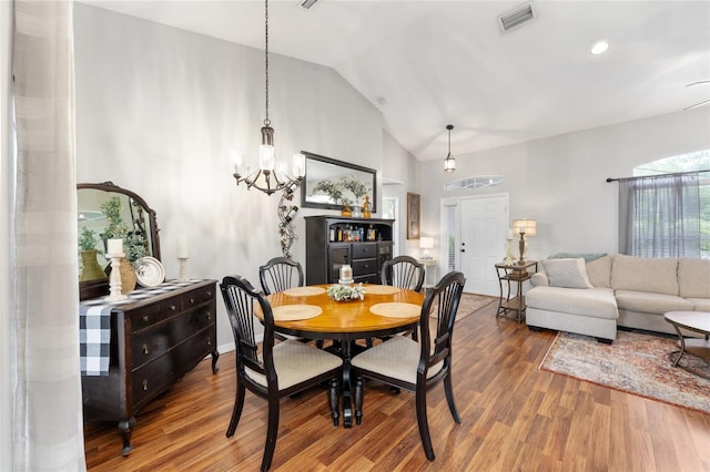 6362 N Walter Ter, Citrus Springs, FL 34434 - dining room featuring wood finished floors, a chandelier, and high vaulted ceiling