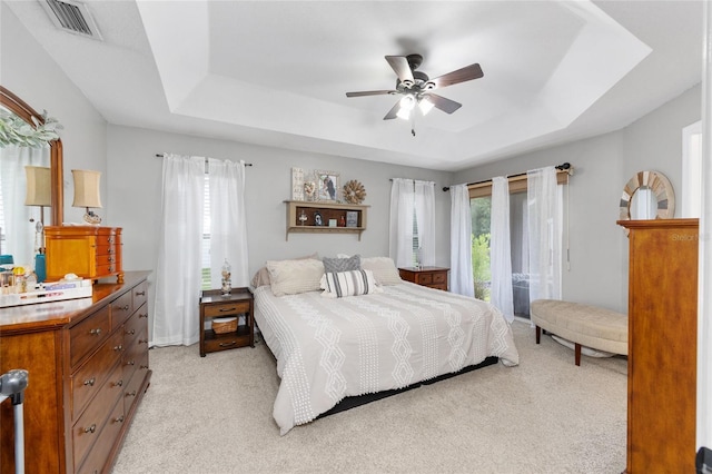 6362 N Walter Ter, Citrus Springs, FL 34434 - bedroom featuring a raised ceiling, light carpet, and ceiling fan
