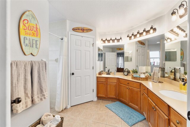6362 N Walter Ter, Citrus Springs, FL 34434 - full bath featuring tile patterned floors, double vanity, tiled shower, and a textured ceiling